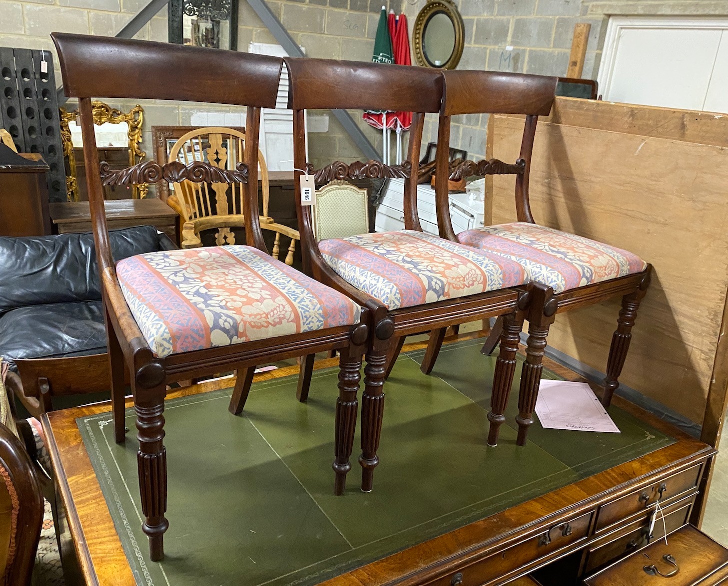 A set of seven Regency mahogany dining chairs, two with arms